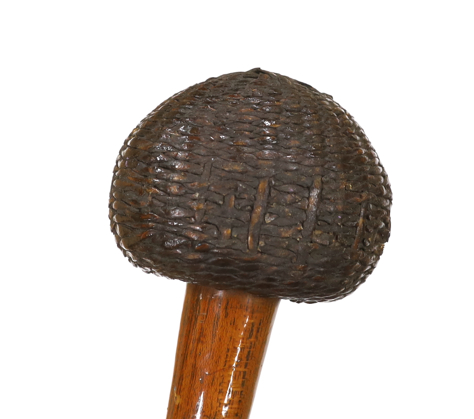 An African carved wooden club in the form of a knobkerry, with swollen head covered in basket weave